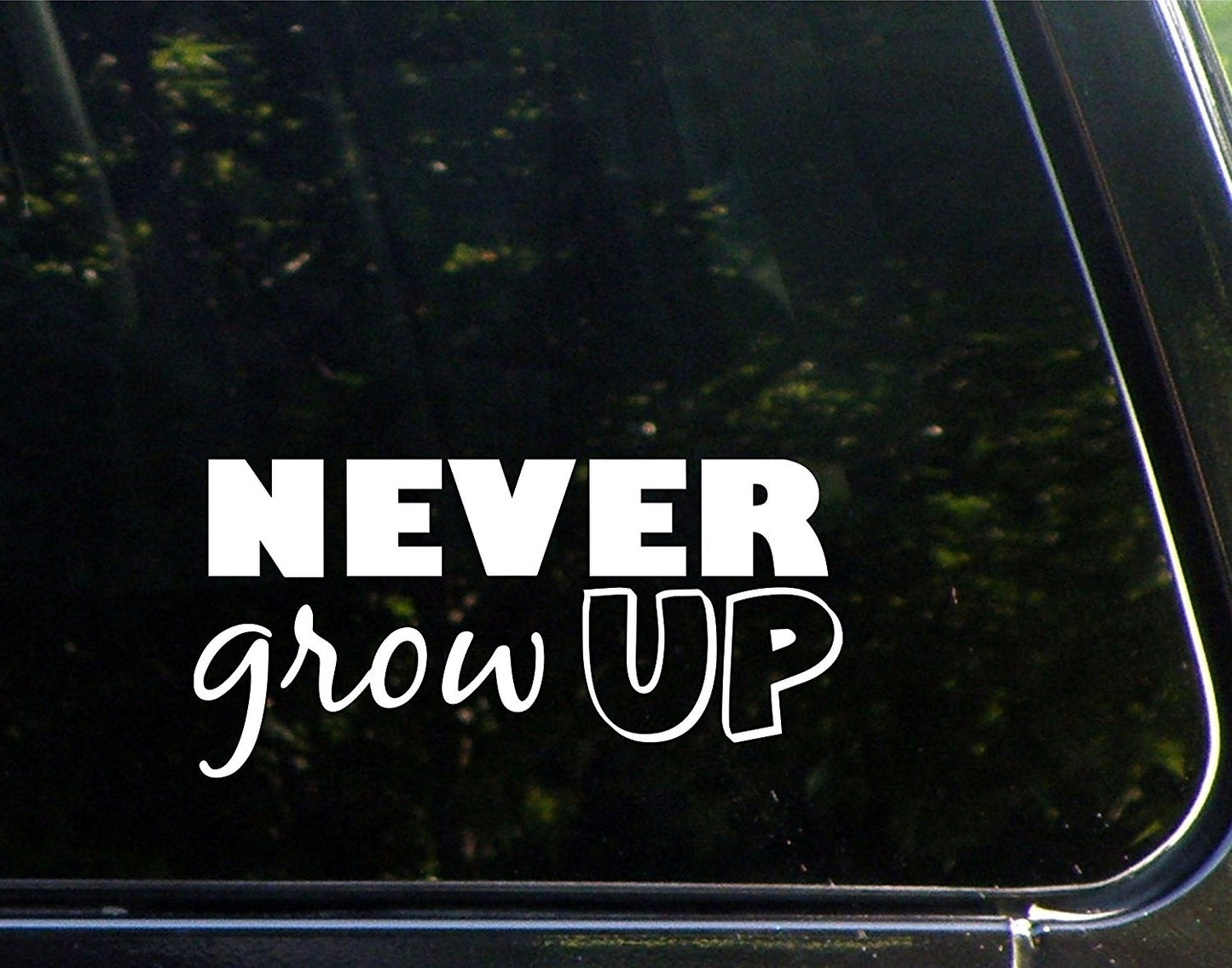 Never Grow Up - 7-3/4inchesx 3-3/4inches - Vinyl Die Cut Decal/ Bumper Sticker for Windows, Cars, Trucks, Laptops, Etc.