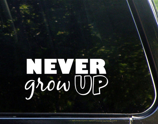 Never Grow Up - 7-3/4inchesx 3-3/4inches - Vinyl Die Cut Decal/ Bumper Sticker for Windows, Cars, Trucks, Laptops, Etc.